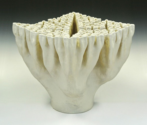 Organic-looking ceramic sculpture based on a crosses fractal, third view.