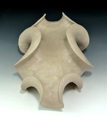 Abstract ceramic sculpture with negative curvature.