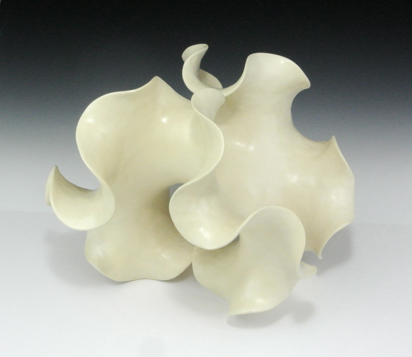 Negative-curvature abstract ceramic sculpture based on a two-fold saddle surface.
